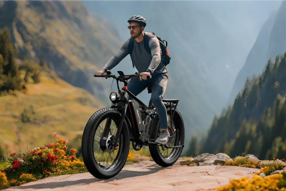 One man riding DUOTTS S26 PRO Off-road Electric Bike on the stony road in the mountains