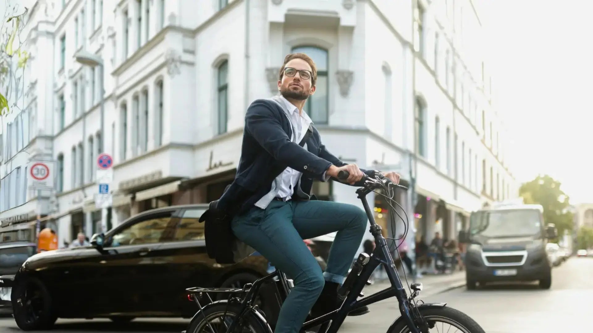 Electric bike commuter at a city crossroad